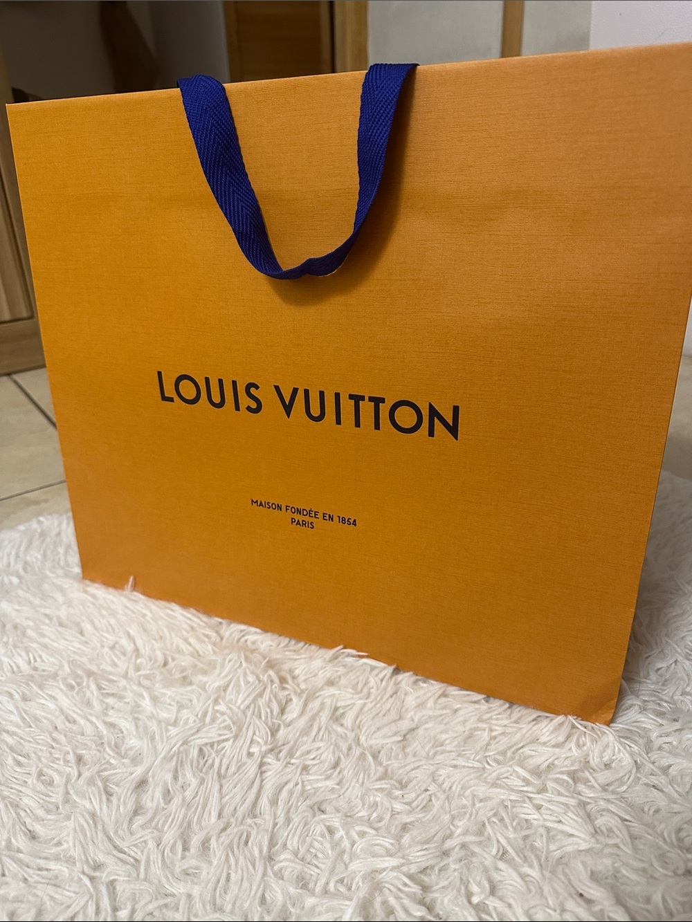 Louis Vuitton Orange Tote with Navy Handles ( size 16”13.5 “ 6.5 “ )